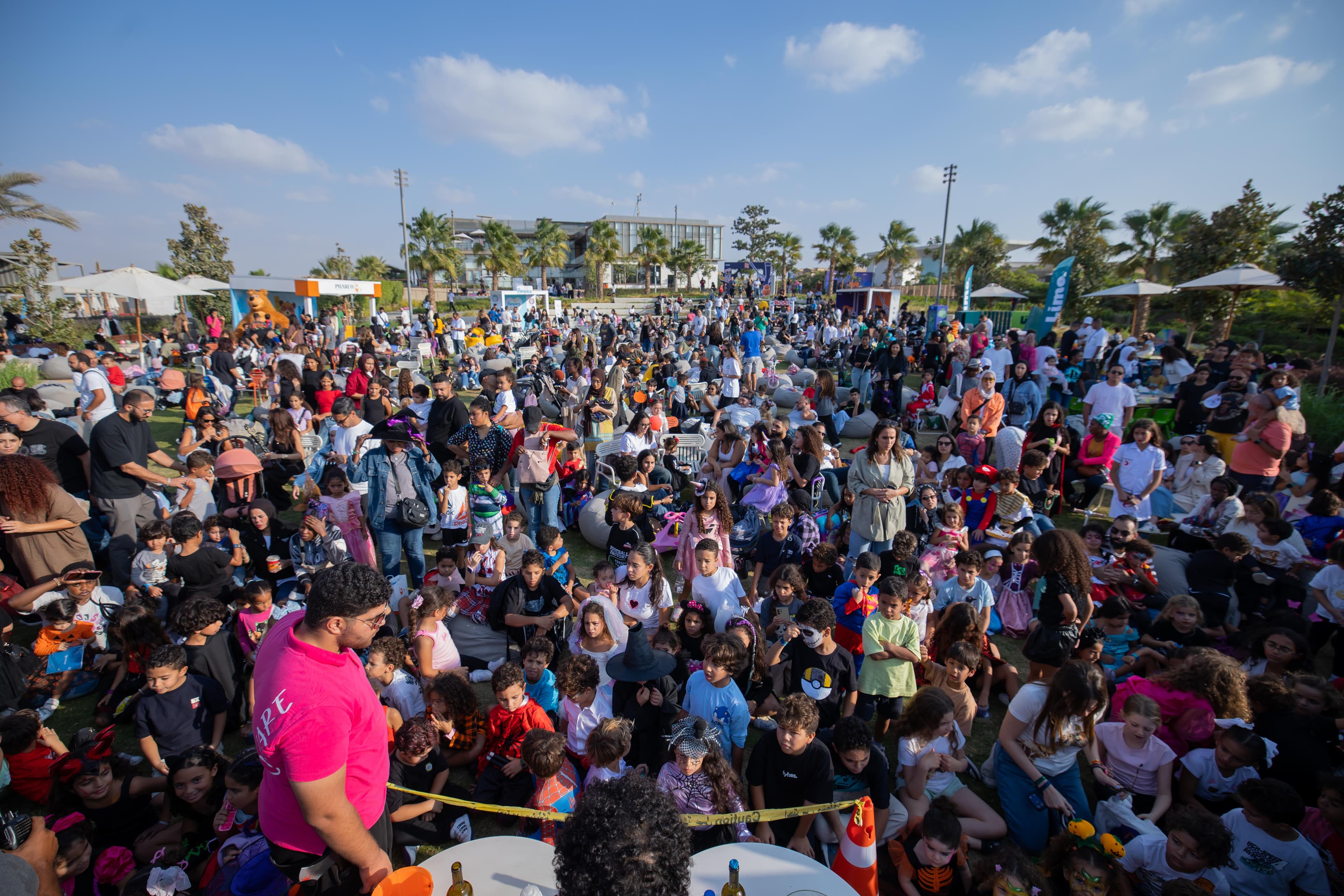 Families gathered across the KODE Club Halloween festival lawn